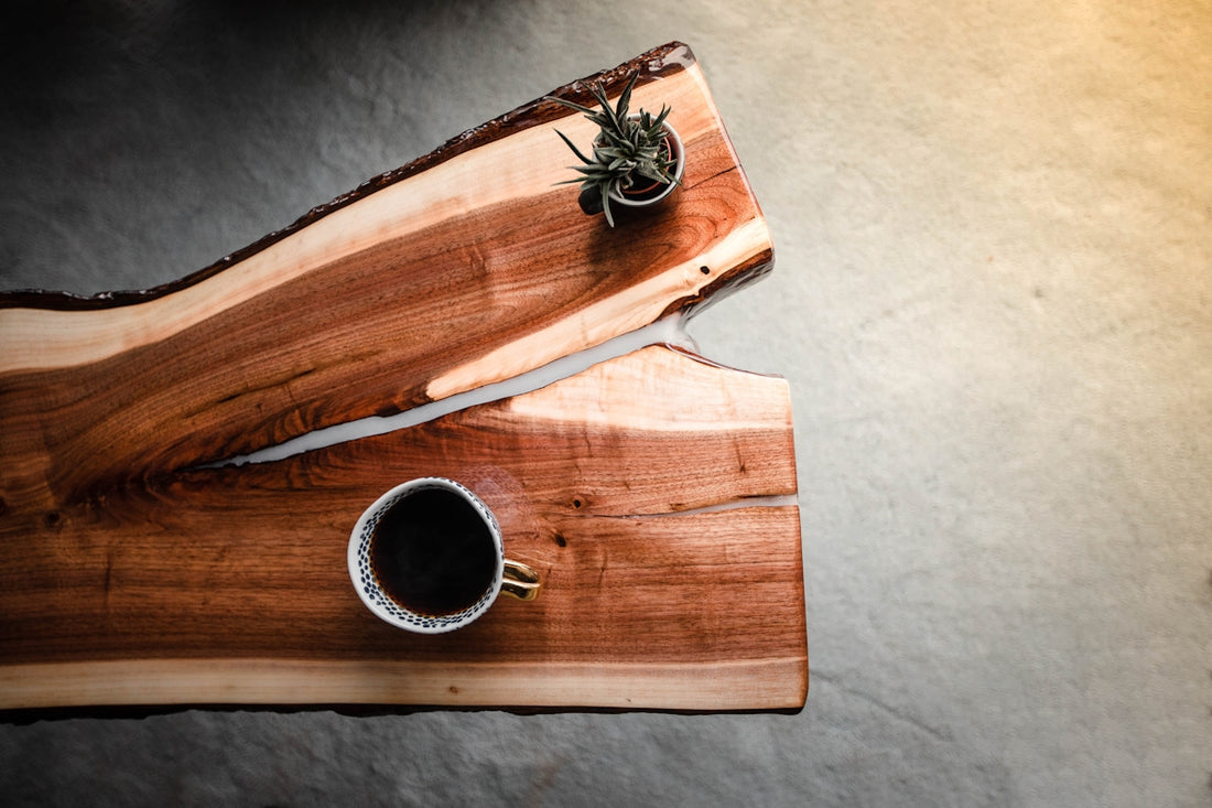 black and white ceramic mug on brown wooden table