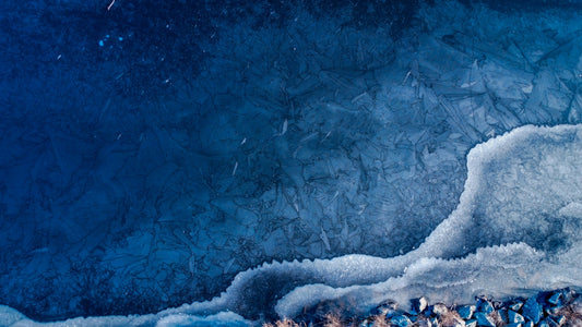 a painting of ice and water with a blue background