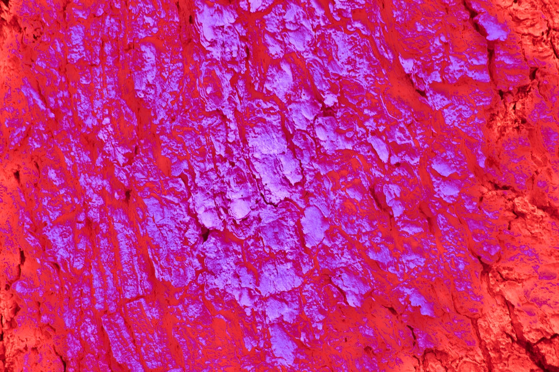 a close up of a red and purple wall