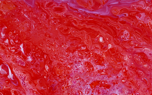 a close up of a red and purple liquid