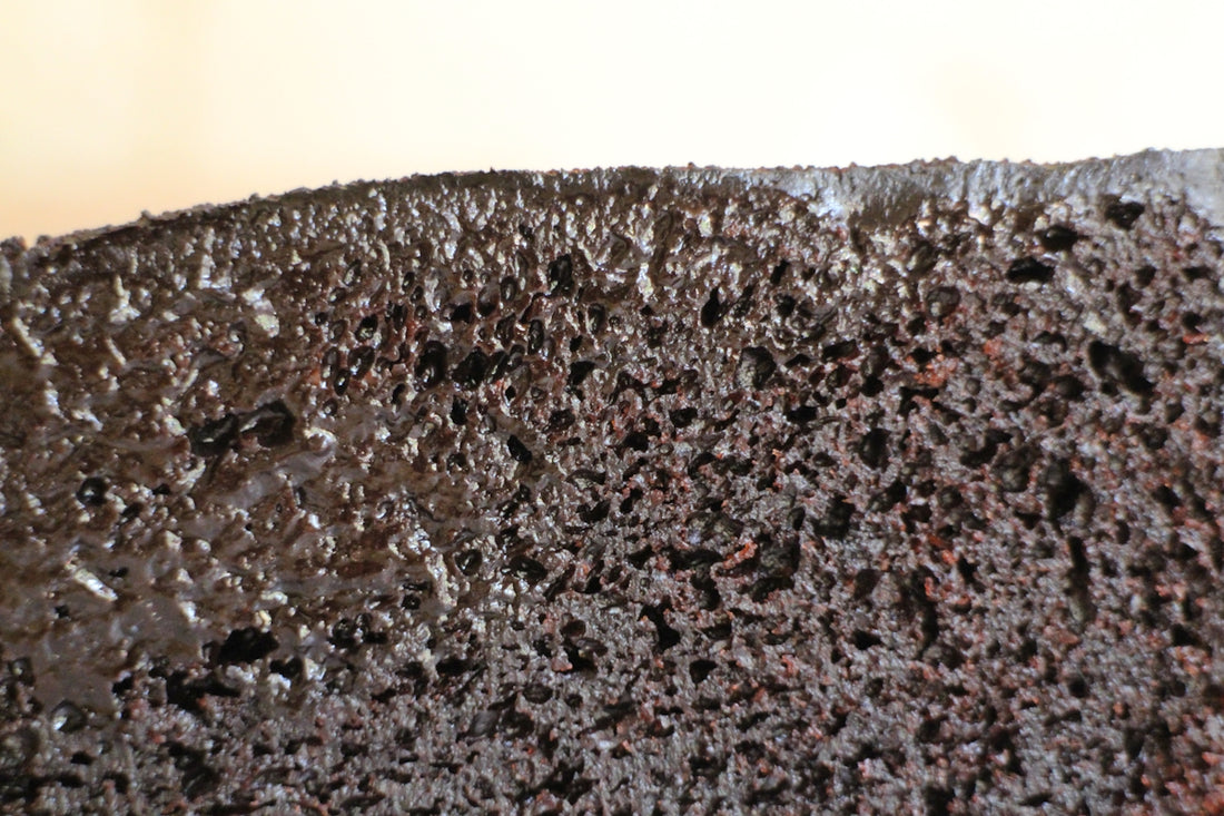 A piece of chocolate cake sitting on top of a table