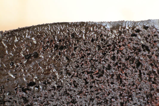 A piece of chocolate cake sitting on top of a table