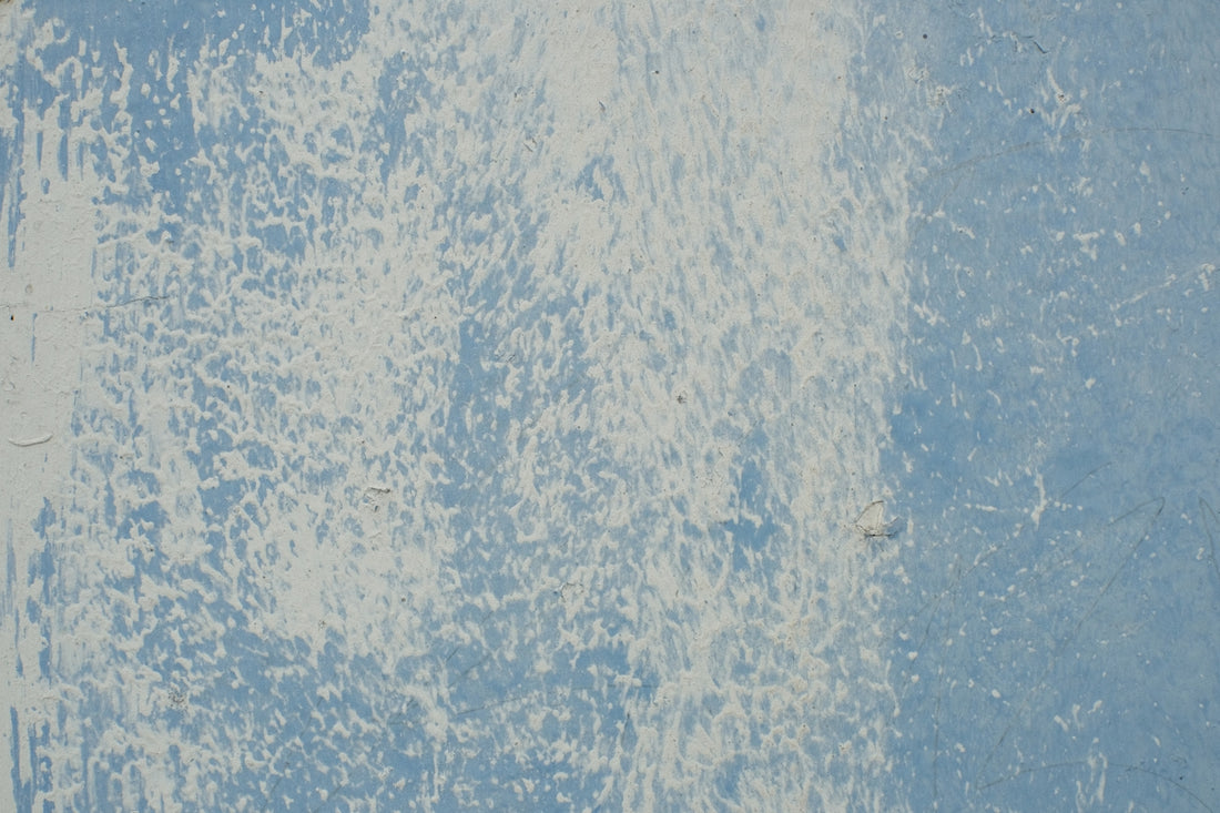 A blue and white wall with a clock on it