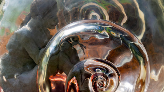 A statue and swirling reflection.